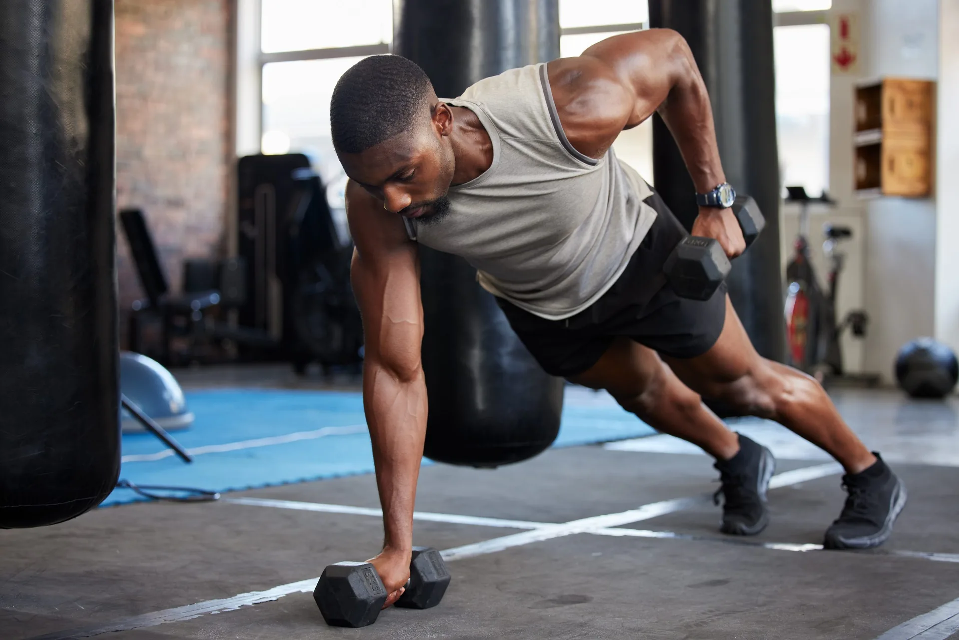 fitness-and-muscle-training-with-dumbbells-in-gym