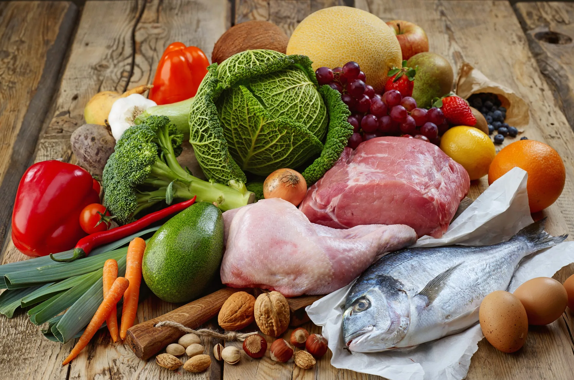 Various Paleo diet products on wooden table