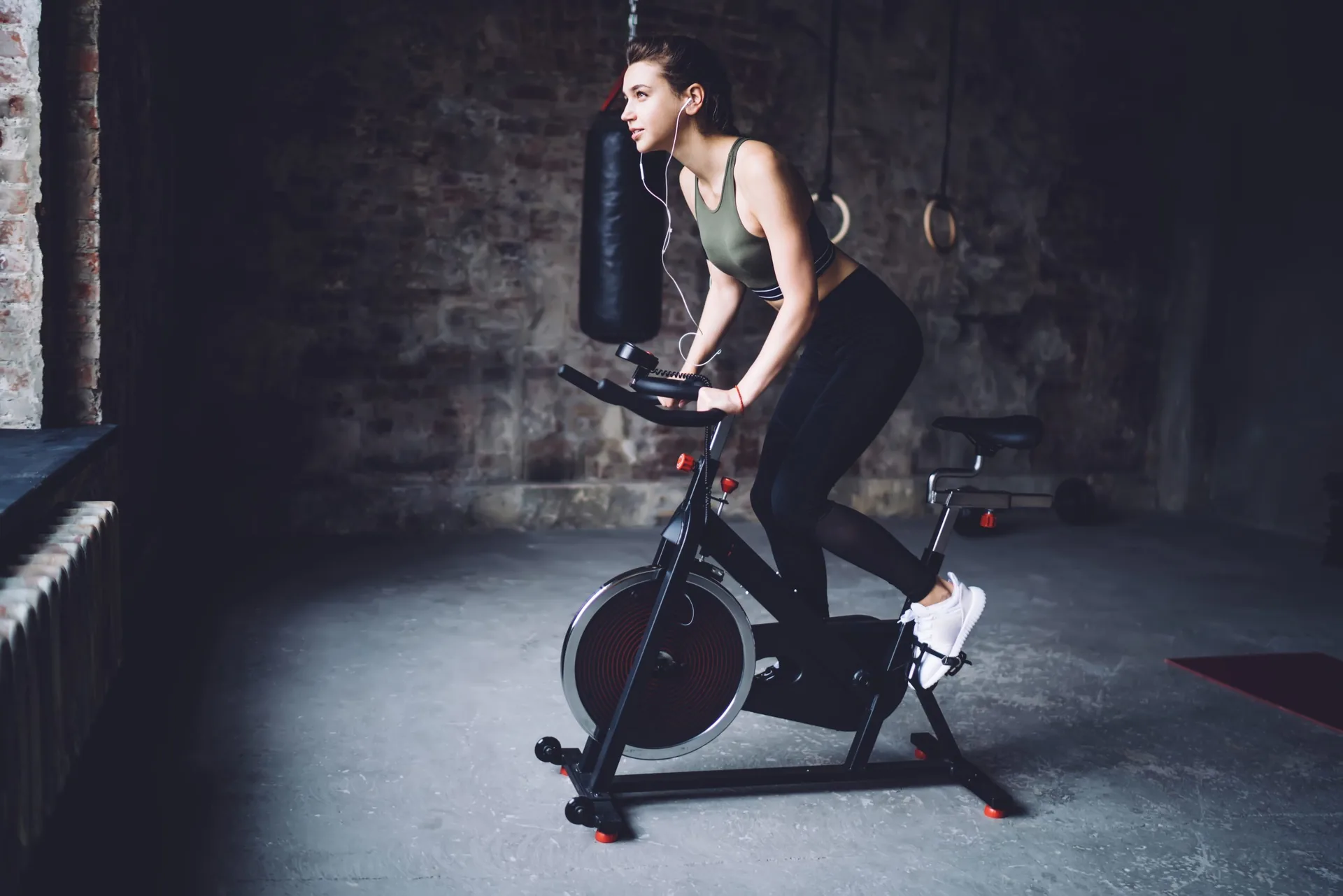 side-view-young-fit-female-device