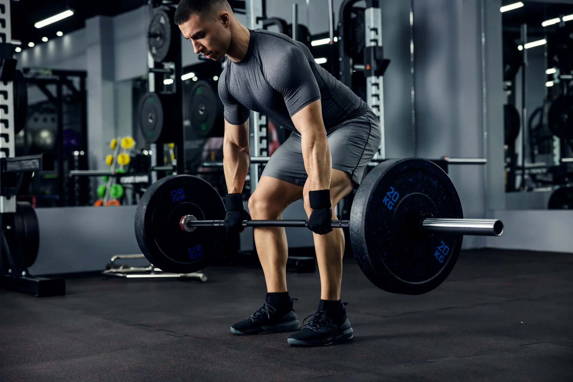 portrait-male-weightlifter-grey-sportswear-he