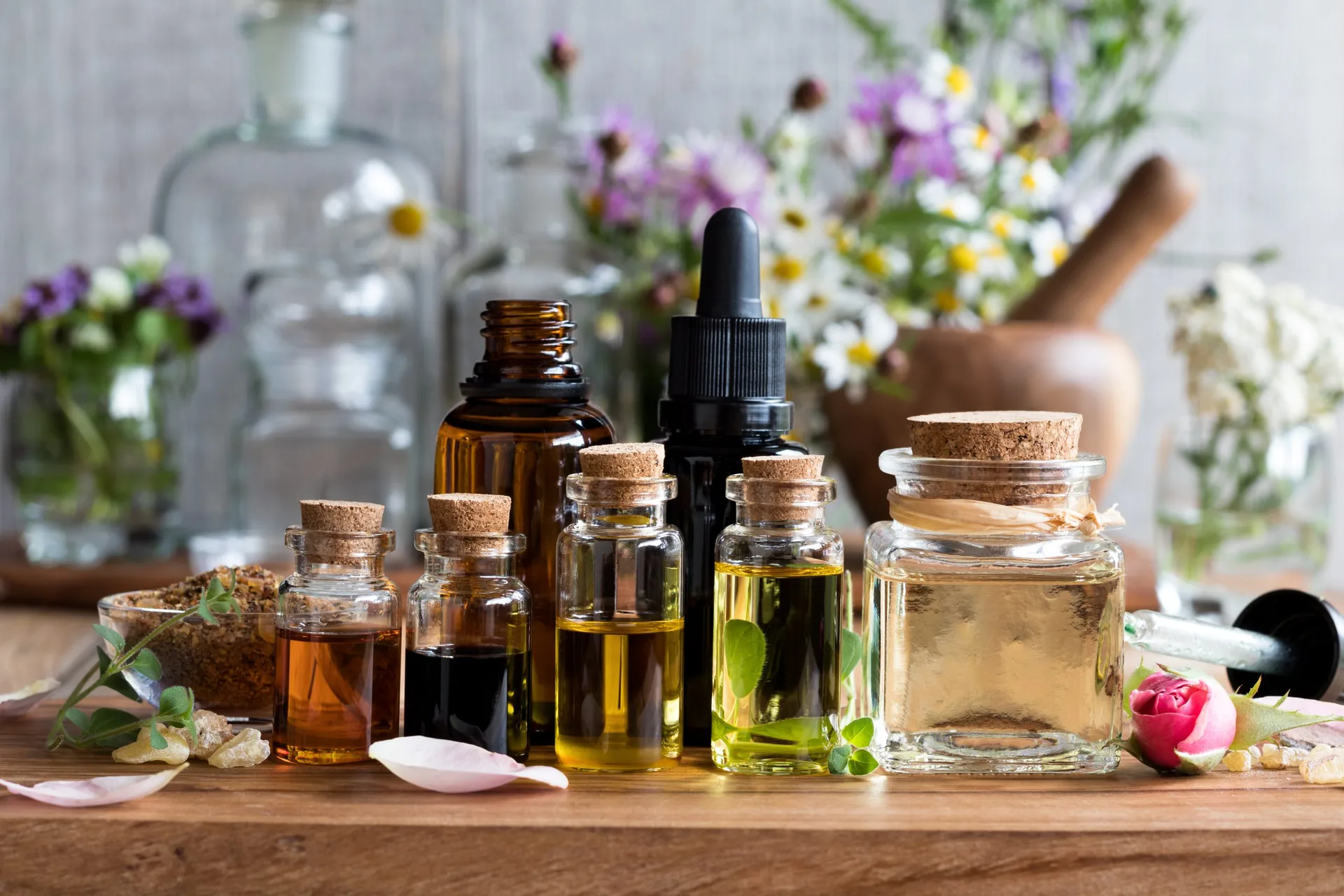selection-essential-oils-herbs-flowers-background