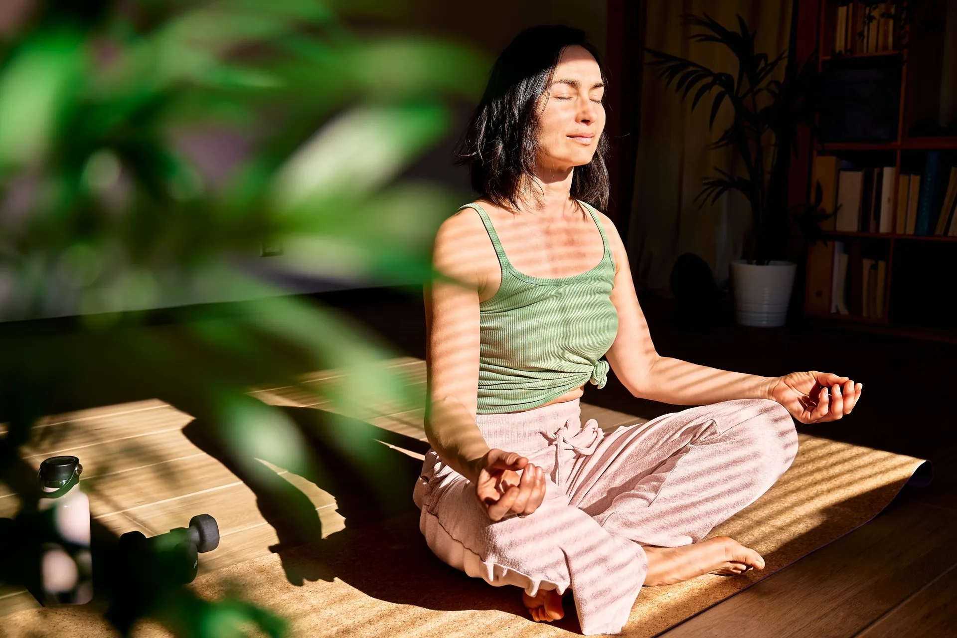 woman-practicing-yoga-meditation-home-sitting