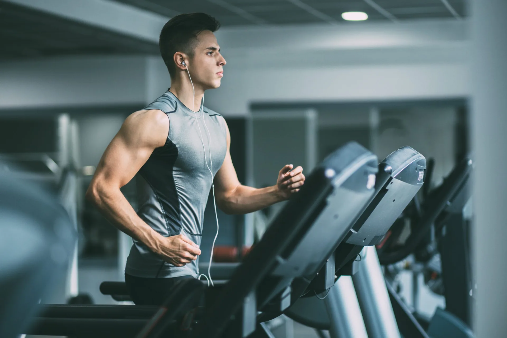 young-man-sportswear-running-on-treadmill