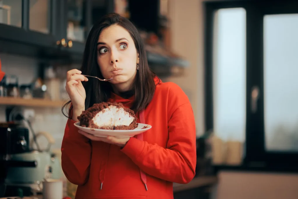 funny-woman-feeling-guilty-eating-cake