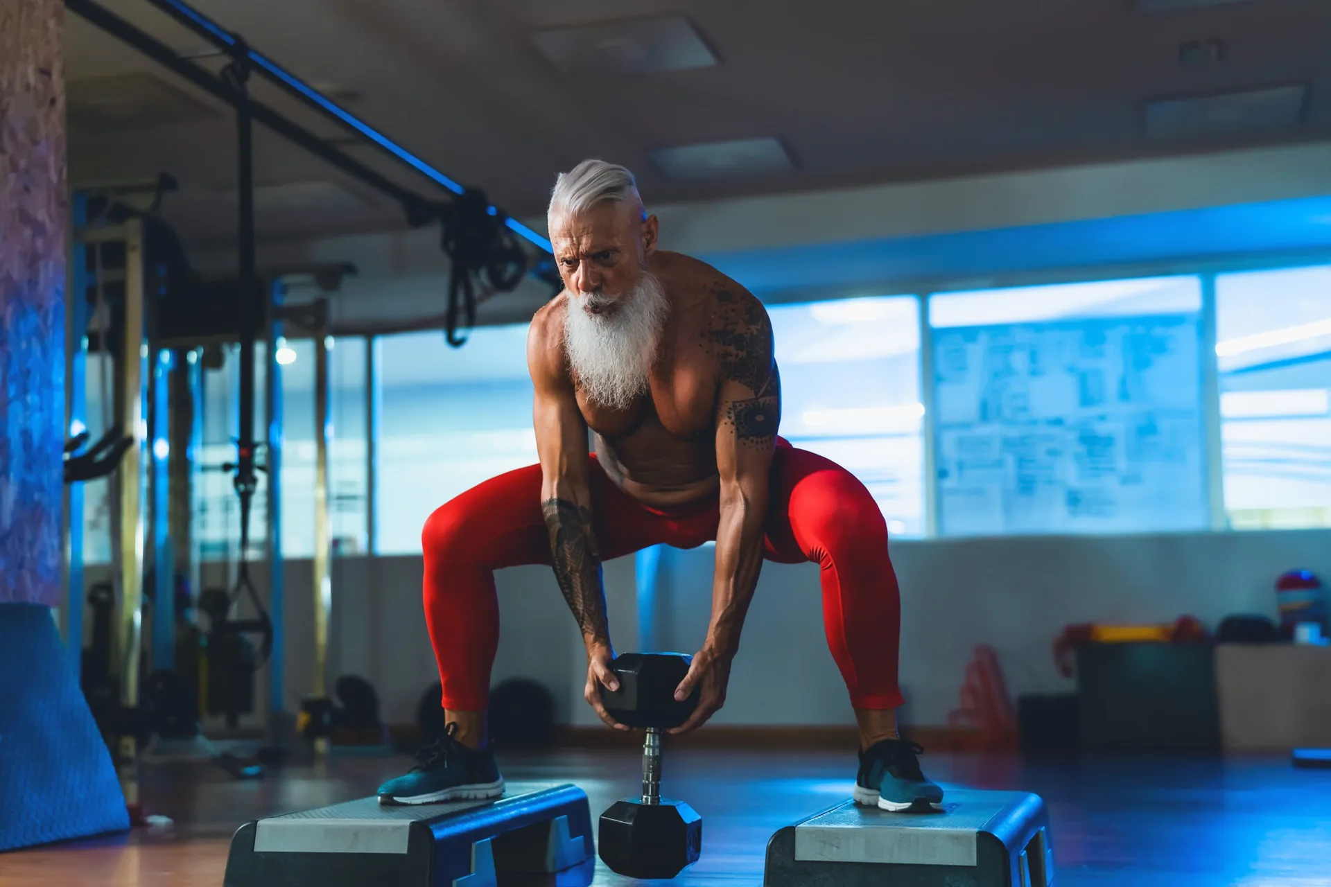 senior-man-doing-workout-exercises-inside