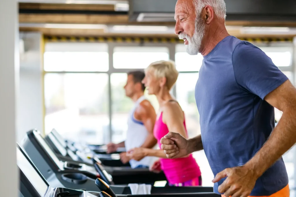 happy-senior-people-doing-exercises-gym