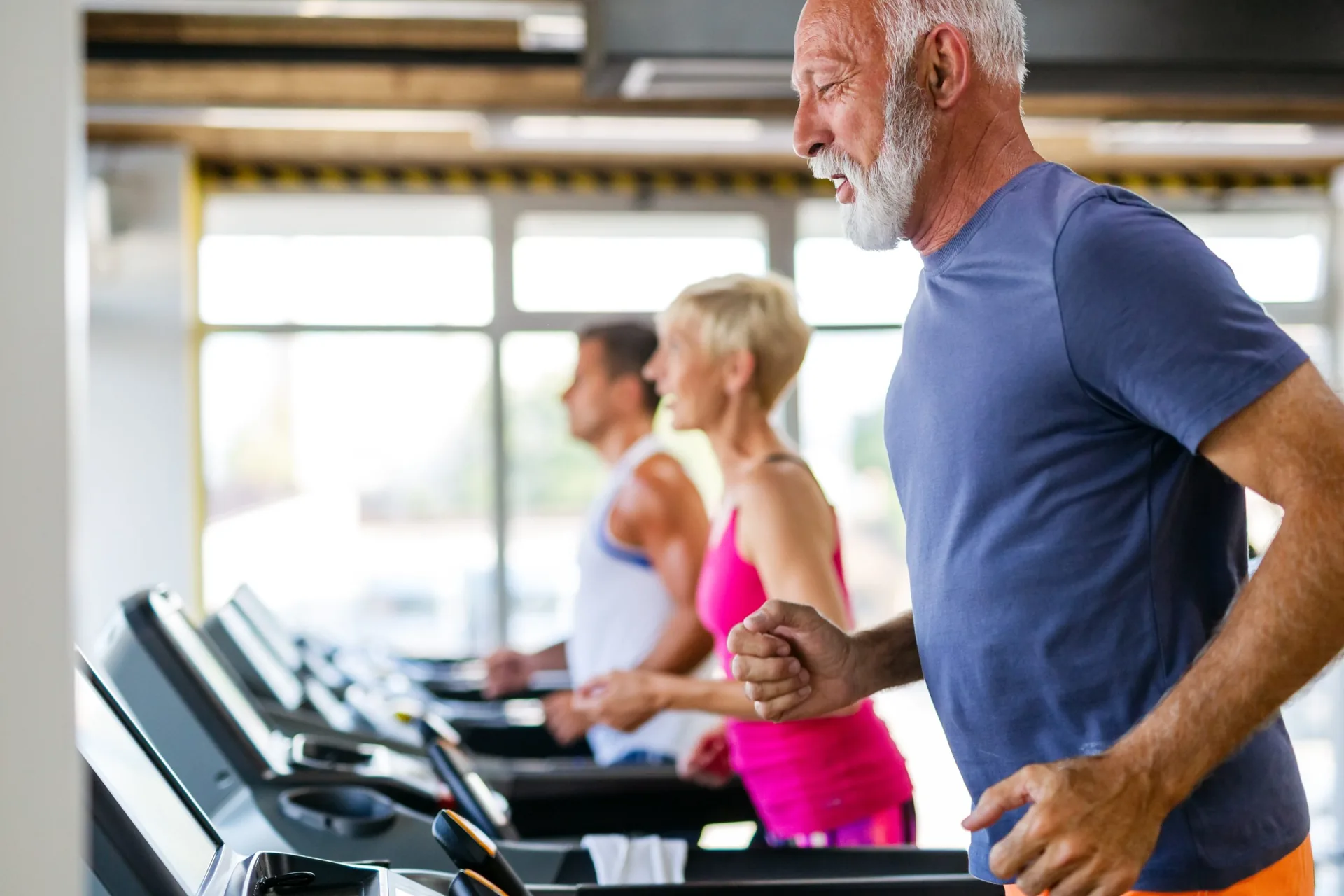 happy-senior-people-doing-exercises-gym