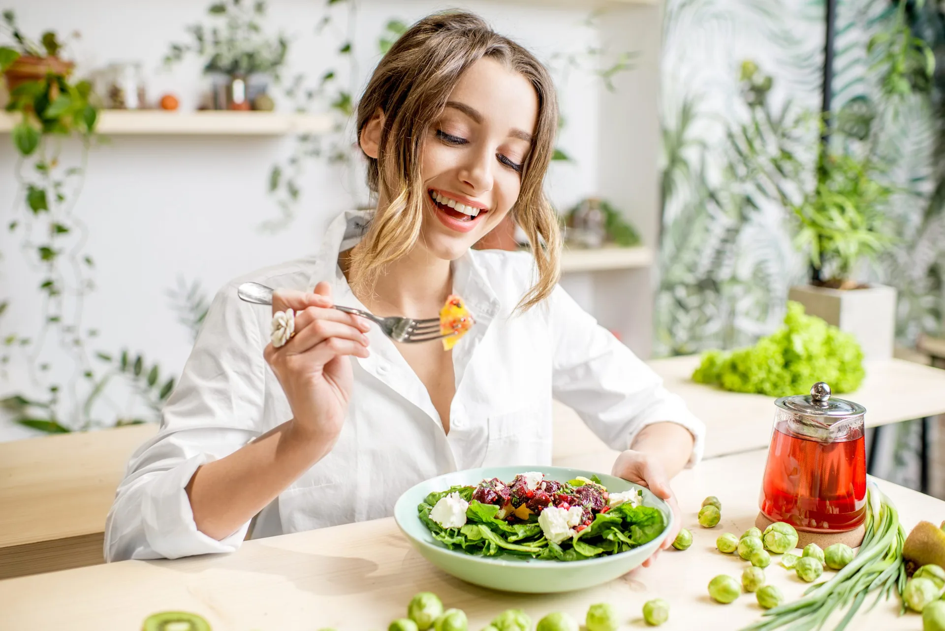 young-woman-eating-healthy-food-sitting