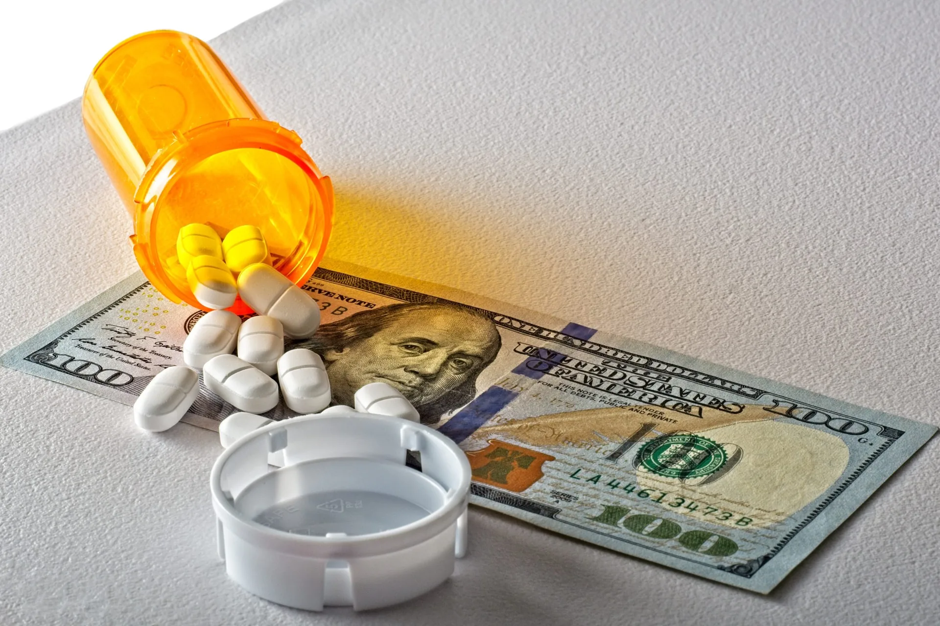 pharmaceutical-cost-concept-lowangle-view-pill