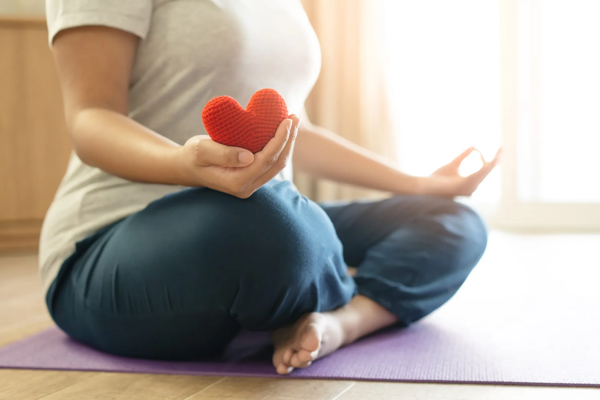 woman-hold-red-yarn-heart-shape