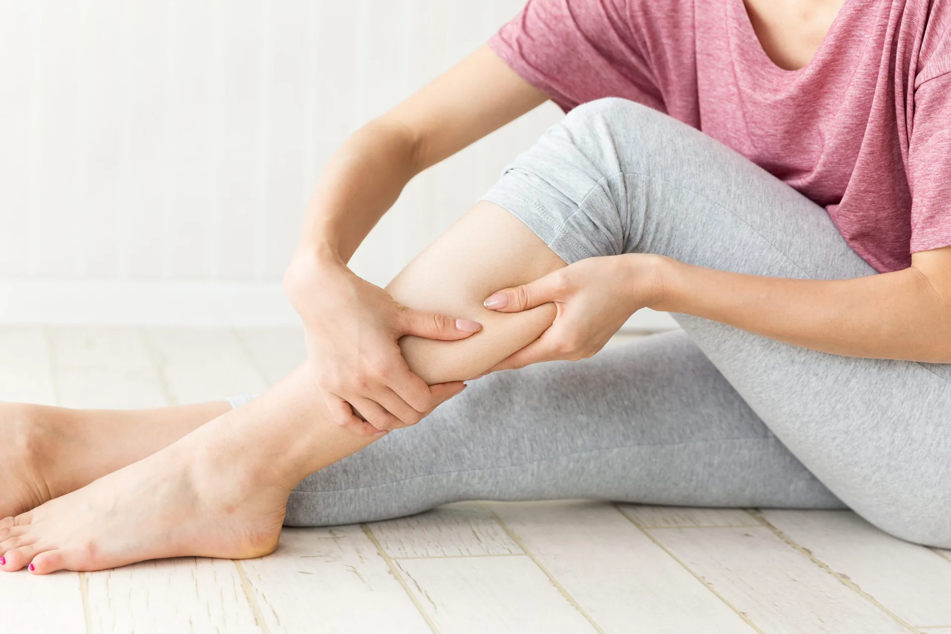 woman-massaging-calf