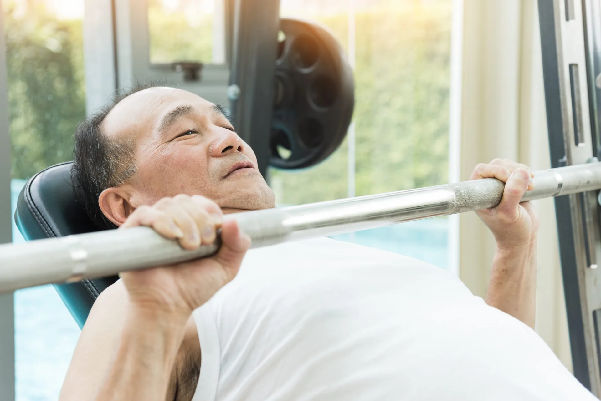 asian-senior-man-lifting-barbell-gym