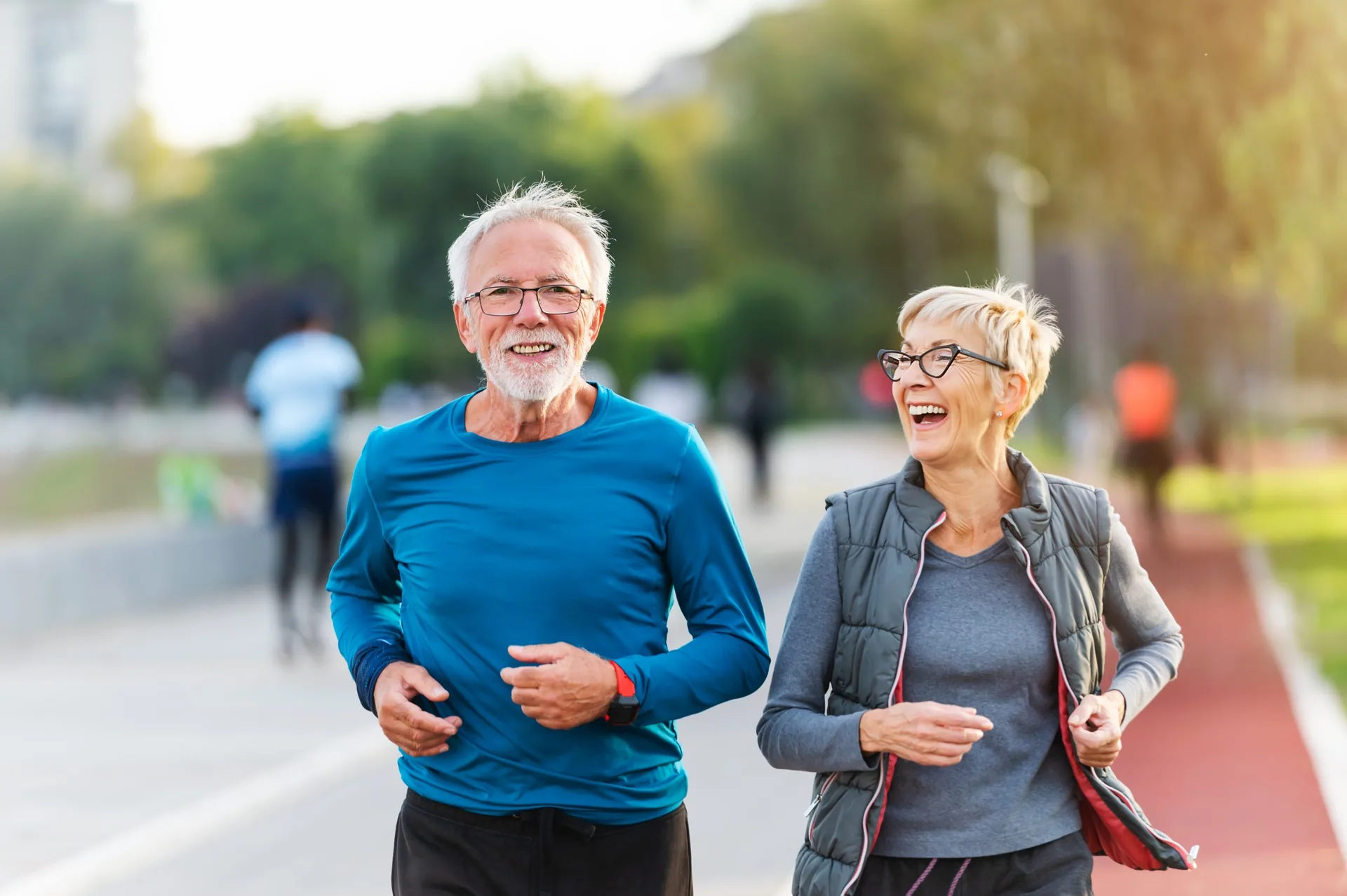 cheerful-active-senior-couple-jogging-together