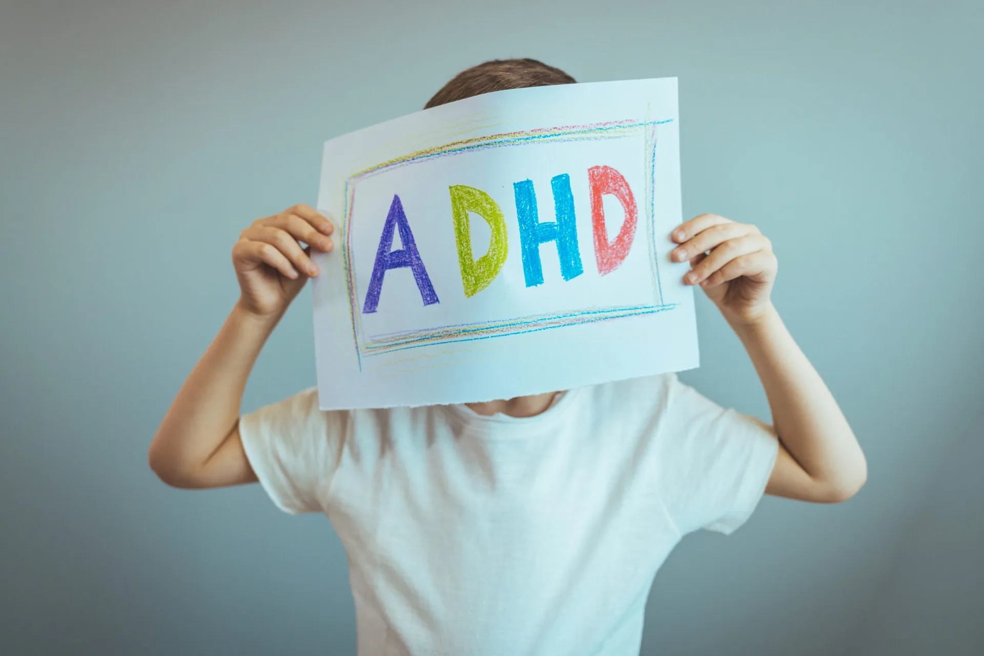 young-boy-holds-adhd-text-written